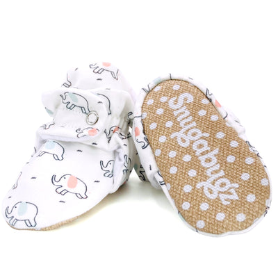 stay-on baby booties featuring an elephant print on white cotton fabric, with non-slip soles and adjustable three snap closure. Made from organic cotton.