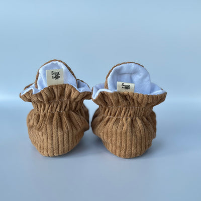 Pair of brown beige baby slippers barefoot shoes with grippy soles